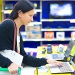 woman in store looking at computer